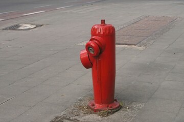 Closeup on a red fire hydrant at the side walk in Brussel, Belgium