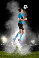 Soccer player hitting ball with head.