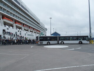 A shuttle bus takes passengers from a cruise ship to the capital Kirkwall, Orkney Islands,...