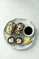 Obraz na płótnie Canvas Black rice sushi rolls with almond and eel