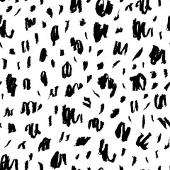 Seamless pattern with charcoal blots and strokes. Black painted different dots. Chaotic ink brush scribbles decorative texture. Messy black pencil doodles. Speckles of different size texture. 