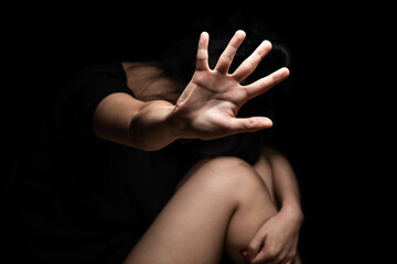 Fototapeta premium International Human Right day Concept: a girl with her hand extended signaling to stop