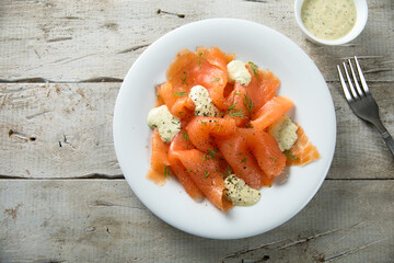 Traditional smoked salmon with dill sauce