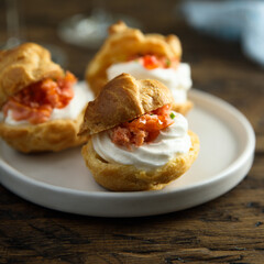 Homemade profiteroles with salmon and cream cheese