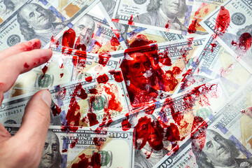 Dollars and hands in red blood stains. Arrested for illegal crime. Broken the law. Bribe concept..Criminal problems. Illegal selling of money.
