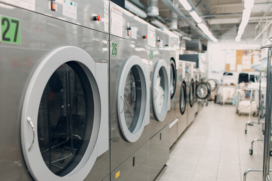 Dry Cleaning With Washing Machine Spin Clothes. Clean Cloth Chemical Process. Laundry Industrial Dry-cleaning