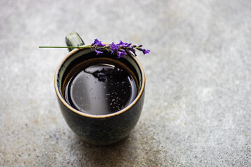 Ceramic cup of coffee with lavender
