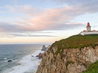 Fototapeta na wymiar Lighthouse on the rock at Cabo da Roca