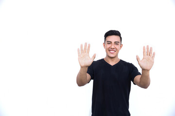 Handsome hispanic man is showing nine fingers isolated on white background.