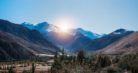 Paiguano or Paihuano aerial view of vineyards and snowy mountains in winter, Valle del Elqui in...