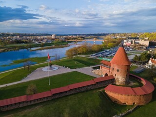 Kaunas castle made of red brick red flag installed in front of it in Lithuania