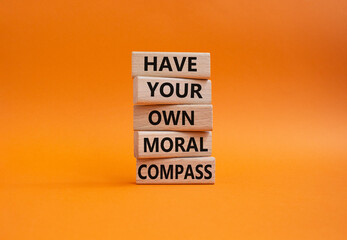 Have your own moral compass symbol. Business Concept words Have your own moral compass on wooden blocks. Beautiful orange background. Business and Have your own moral compass concept. Copy space
