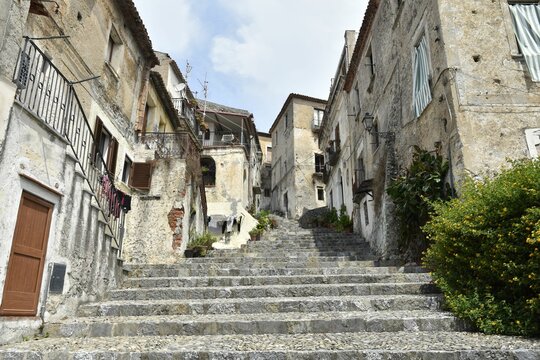 Low angle shot of a narrow street between old houses in Scalea village, the Calabria region, Italy