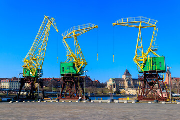 Old cranes on city boulevard in Szczecin, Poland