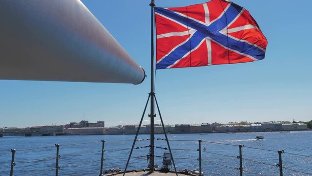 SAINT PETERSBURG, RUSSIA Close-up shot of a flag on the cruiser Aurora on a sunny summer day. Famous cruiser museum on the Neva river