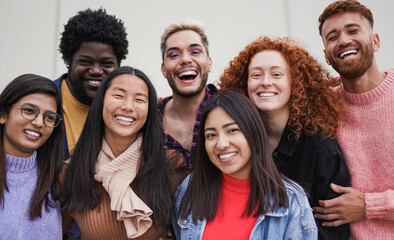 Group of multiethnic young people having fun outdoor while smiling on camera - Focus on the asian girl face