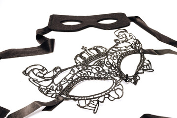 two black masks for a masquerade on a white background