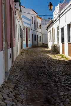 Vertical of a narrow street and old houses in Aieta village, the Calabria region, Italy