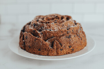An ornate and decorative homemade and fresh chocolate chip bundt cake