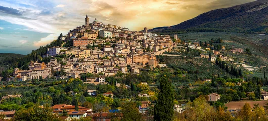 Poster Traditional scenic countryside of Italy and famous medieval hilltop villages of Umbria - Trevi town over sunset, Perugia province © Freesurf