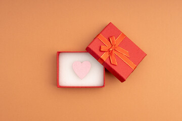 open red gift box with a heart inside