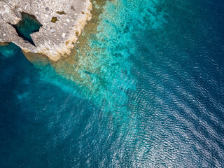Fototapeta na wymiar Italy, July 2022: rocky coves, Caribbean sea at the tremiti islands in Puglia
