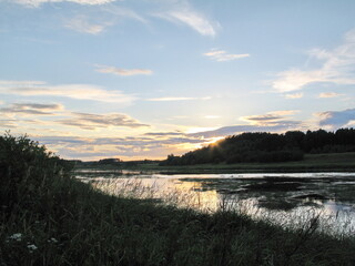 summer river in the countryside in the evening