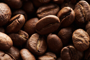 Roasted coffee beans macro close up background