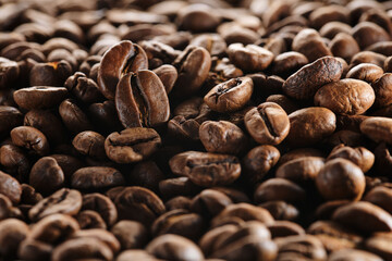 Roasted coffee beans macro close up background