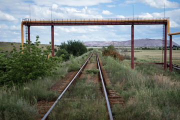 Obraz premium Railway bridge over the railroad. Landscape countryside with railway