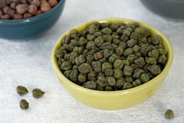 Dry green chickpea peas pile in a bowl.