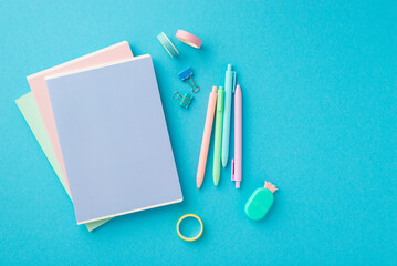 Back to school concept. Top view photo of trendy stationery stack of notepads pineapple shaped...