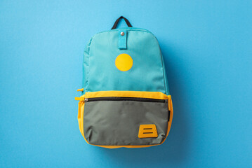 Back to school concept. Top view photo of blue backpack on isolated blue background