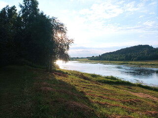 summer river in the countryside in the evening