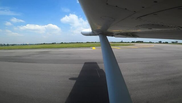A plane takes of the African runway, view from the wing. High quality FullHD footage