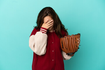 Young caucasian woman playing baseball isolated on blue background with tired and sick expression