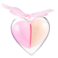 Facial sponges in transparent packaging in the shape of a heart