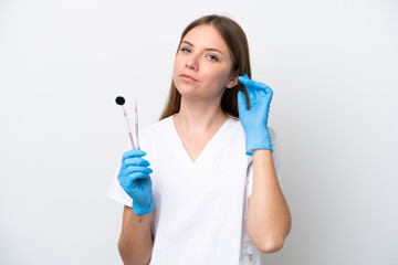 Dentist woman holding tools isolated on white background having doubts