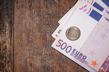 Russian ruble coin and euro banknote. copy space