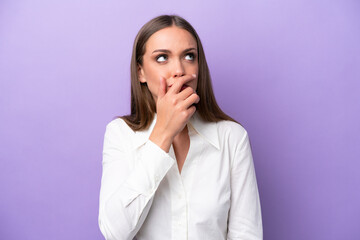 Young caucasian woman isolated on purple background having doubts and with confuse face expression