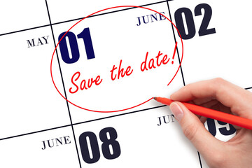 Hand drawing red line and writing the text Save the date on calendar date June 1.