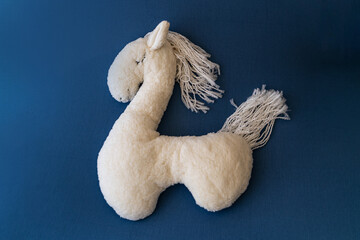 white llama on a blue background for newborn photography