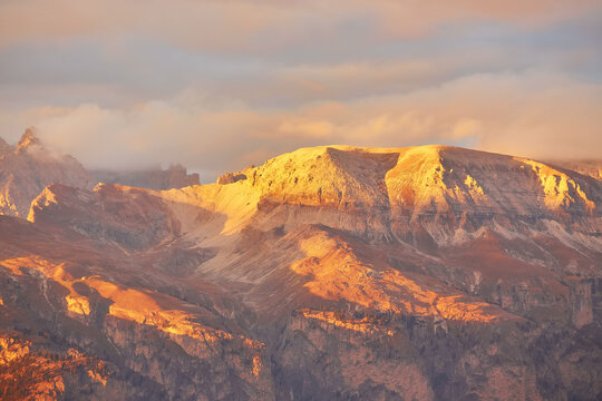sunset over the Catinaccio group seen by Pozza di Fassa inside the Dolomite mountain range © Ryzhkov Oleksandr