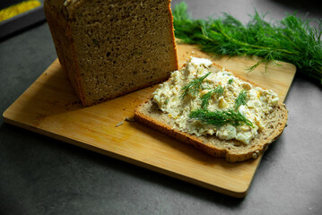 homemade wholemeal bread with sunflower seeds, sandwich with egg paste and dill