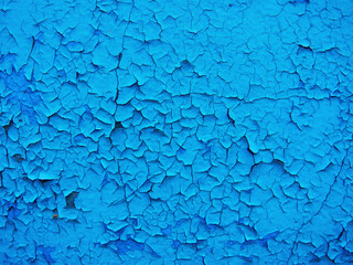 Old cracked wall background, dirty grunge texture. Paint peeling plaster walls. the cement walls are broken blue paint