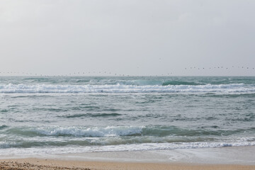 Sky, sea and sand with pebbles as a background. Natural landscape view of a beautiful tropical beach and sea on a sunny day. Beach sea area. Panorama of a beautiful beach with turquoise water banner