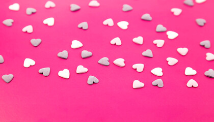 Colorful sugar hearts, decoration for cake and baking, many hearts as background. top view Place for text.