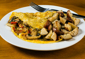 peppers onions and mushromm omelette with home fries