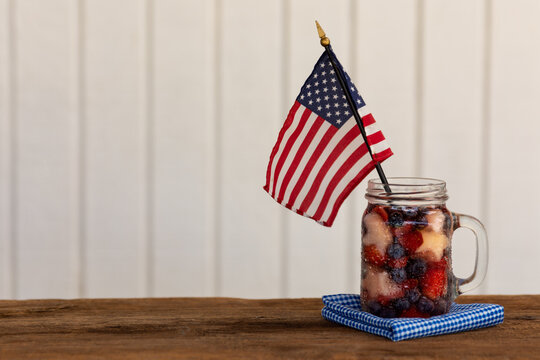 A Red, White And Blue Fruit Saled With A Flag