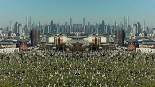Forwards fly above large cemetery, Manhattan skyscrapers in background. Abstract computer effect digital composed footage